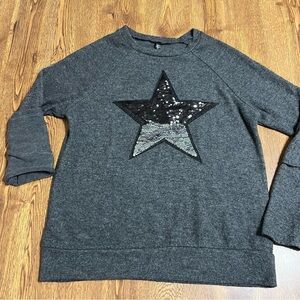 Ladies Revelation brand “flip” Sweater size medium